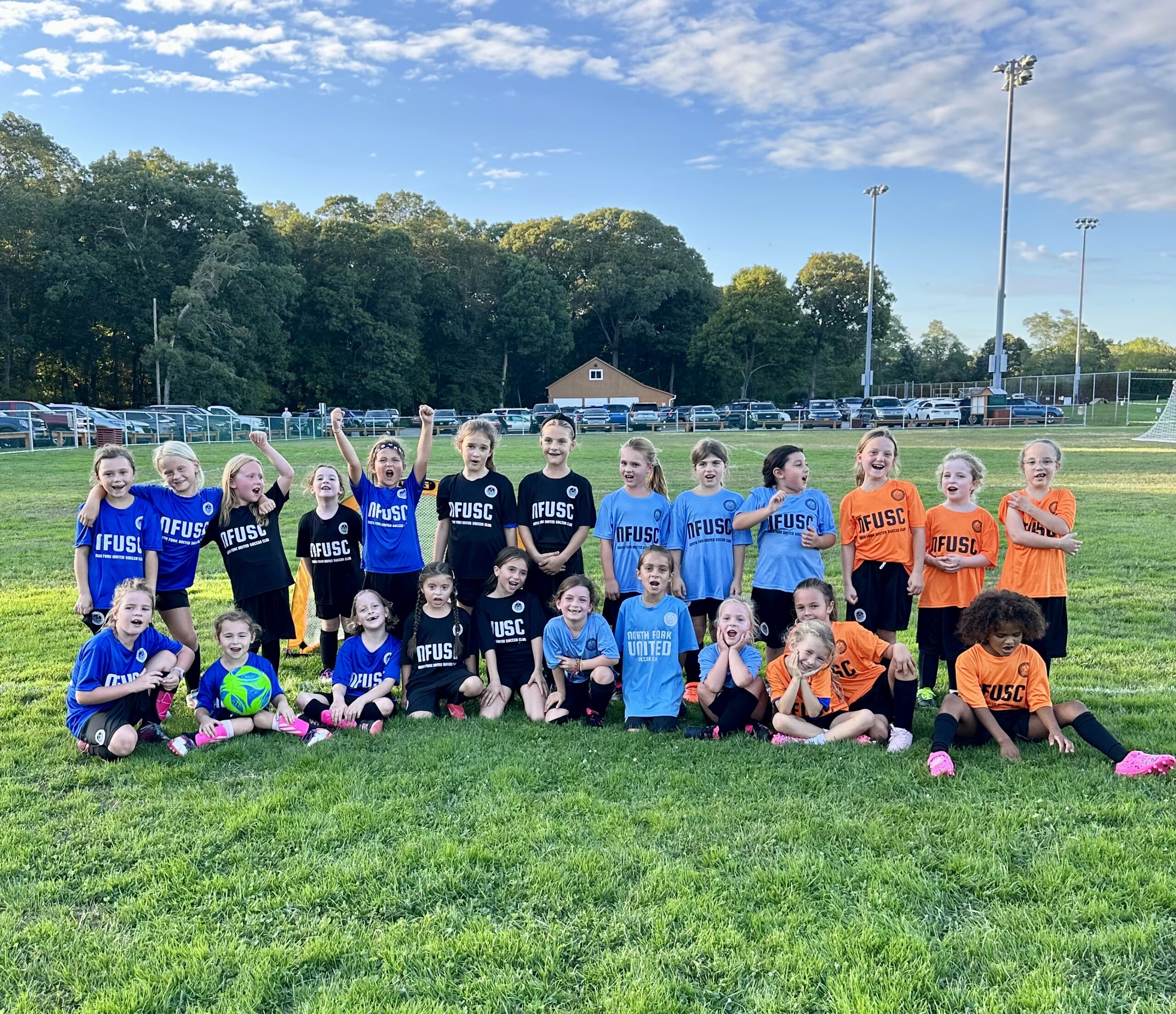 North Fork United girls team celebrating together